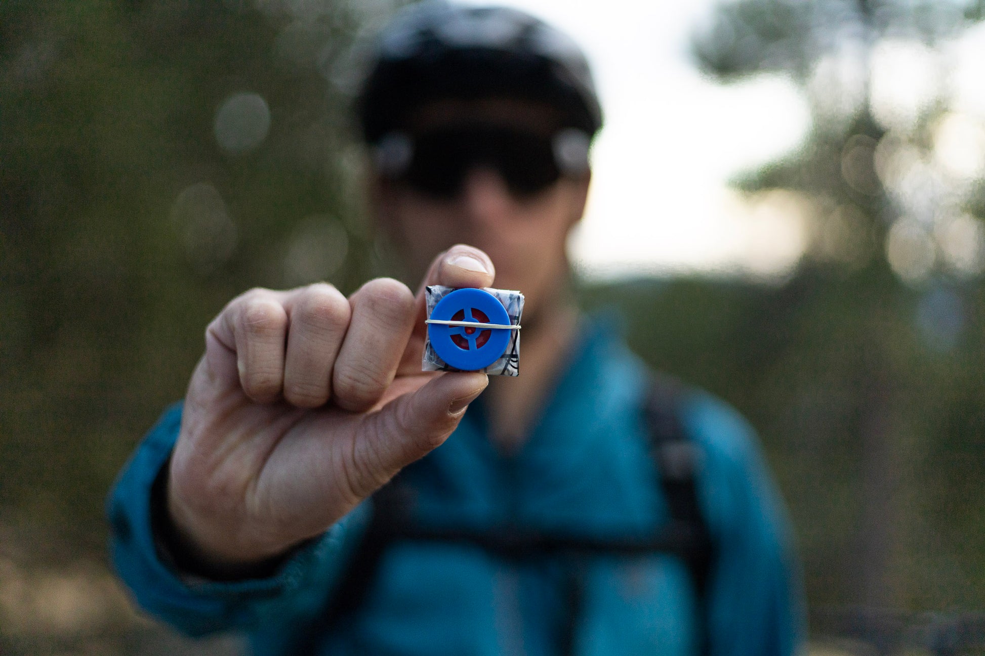 A man holds out a miniature ultralight CPR mark for first aid
