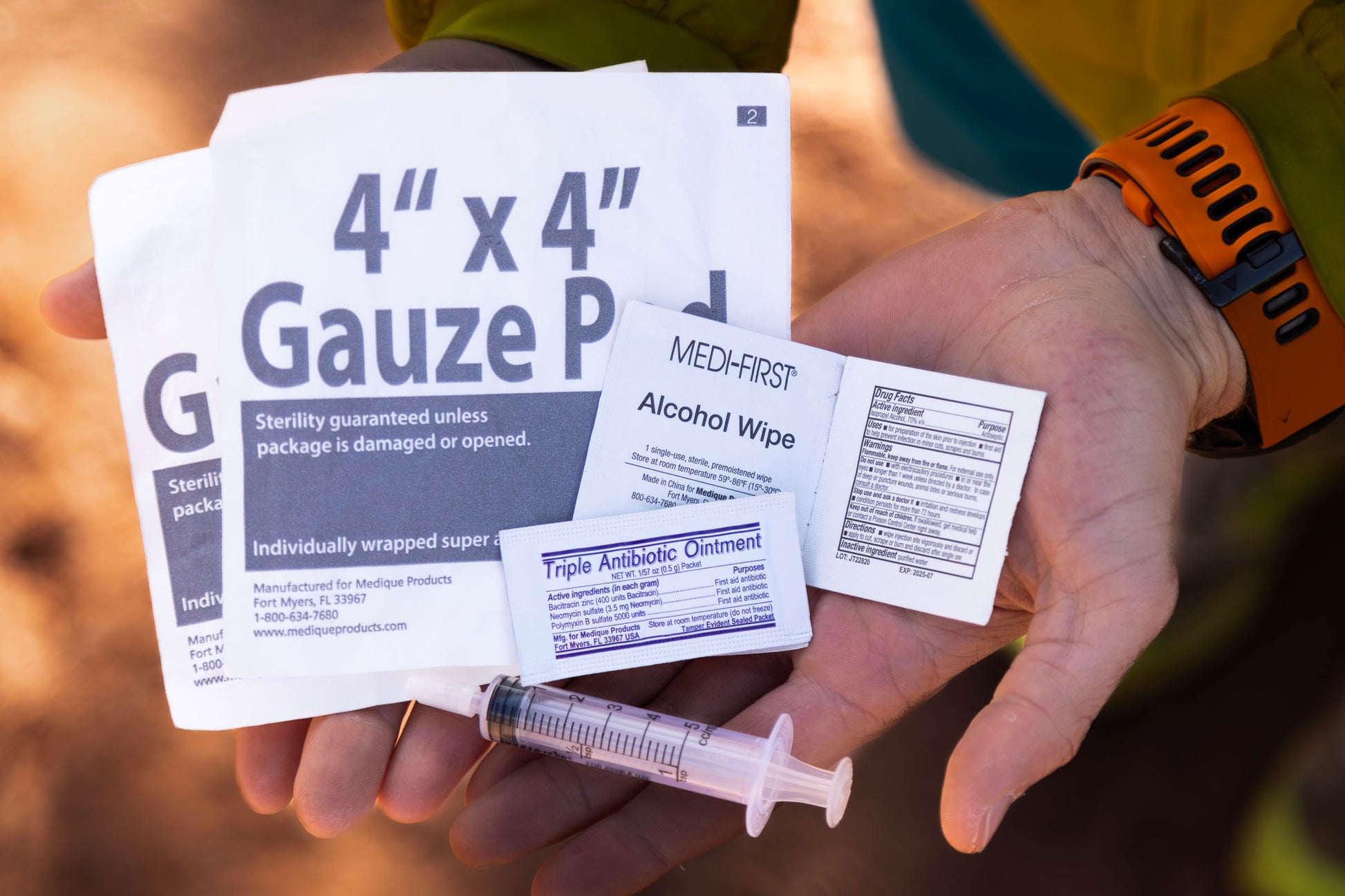 Hands holding the items in the infection upgrade kit