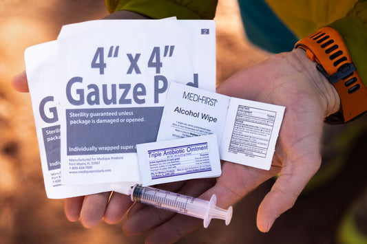 Hands holding the items in the infection upgrade kit