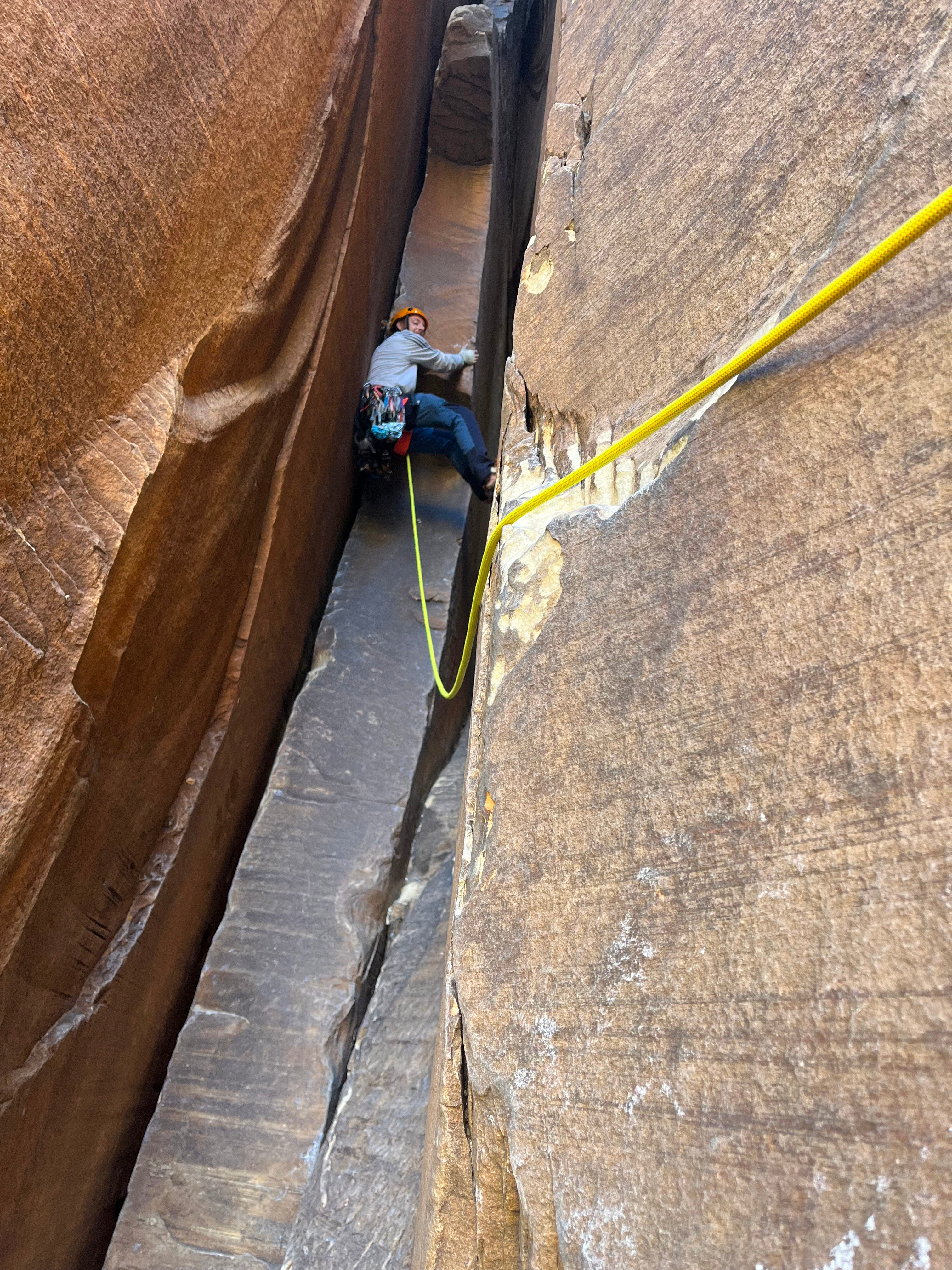 A man climbs a rock